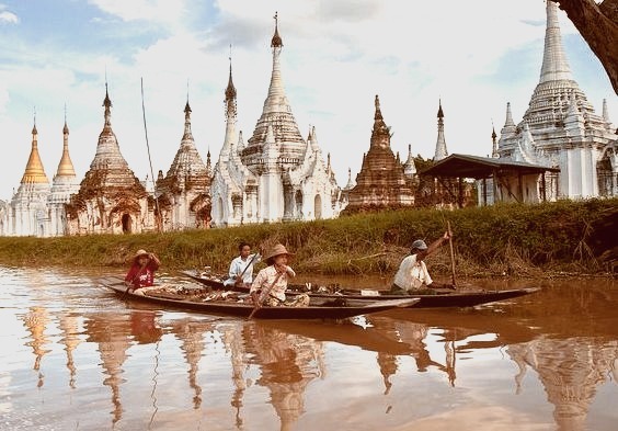 by c.ledur on Flickr.Boating on Inle Lake with buddhist stupas on the background, Myanmar.
