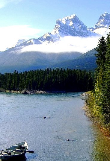Fishing boat on Bow River, Rocky Mountains, Canada